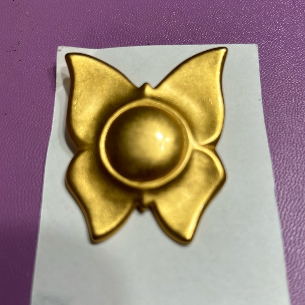 Goldstone brooch